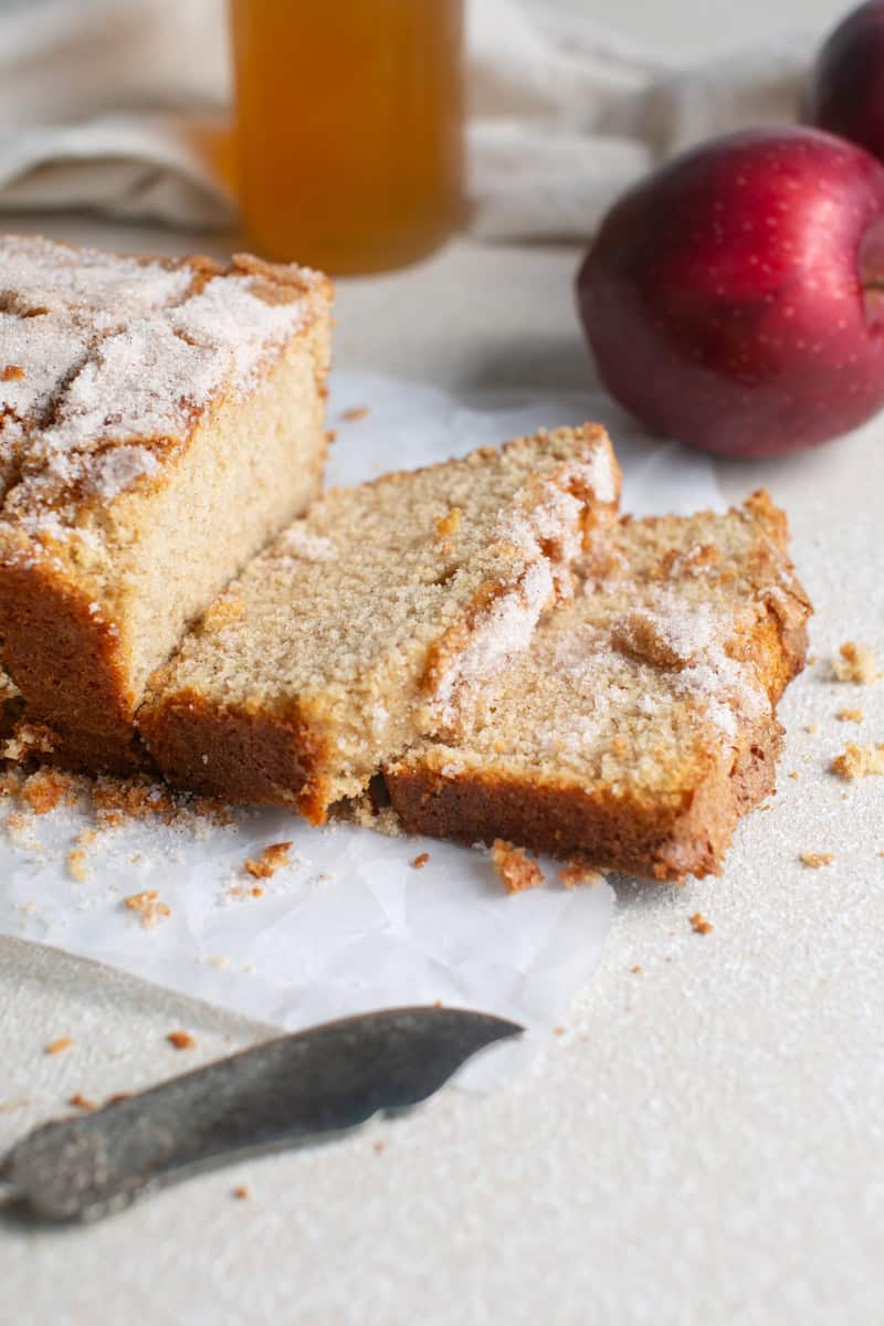 Apple Cider loaf sliced on parchment paper.