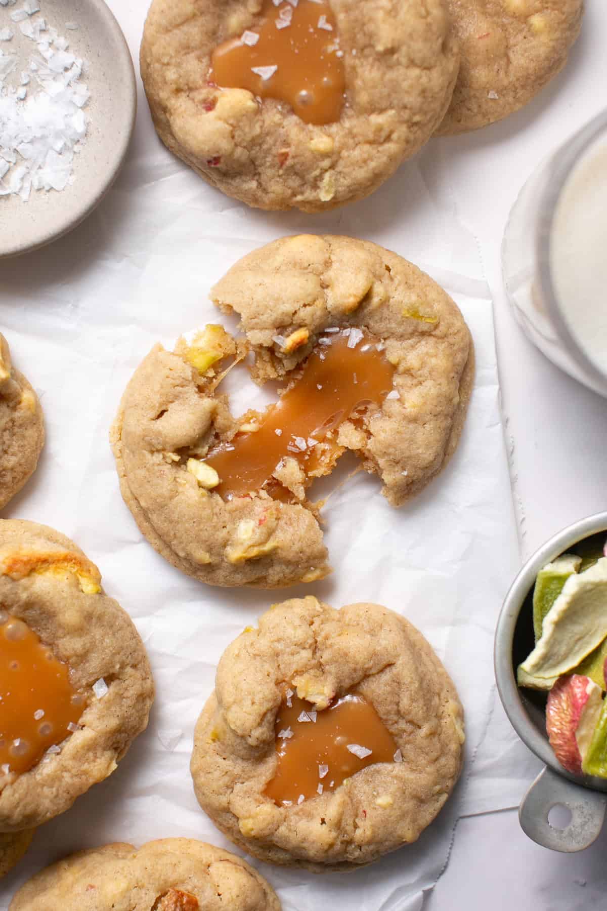 Caramel apple cookies on parchment paper. 