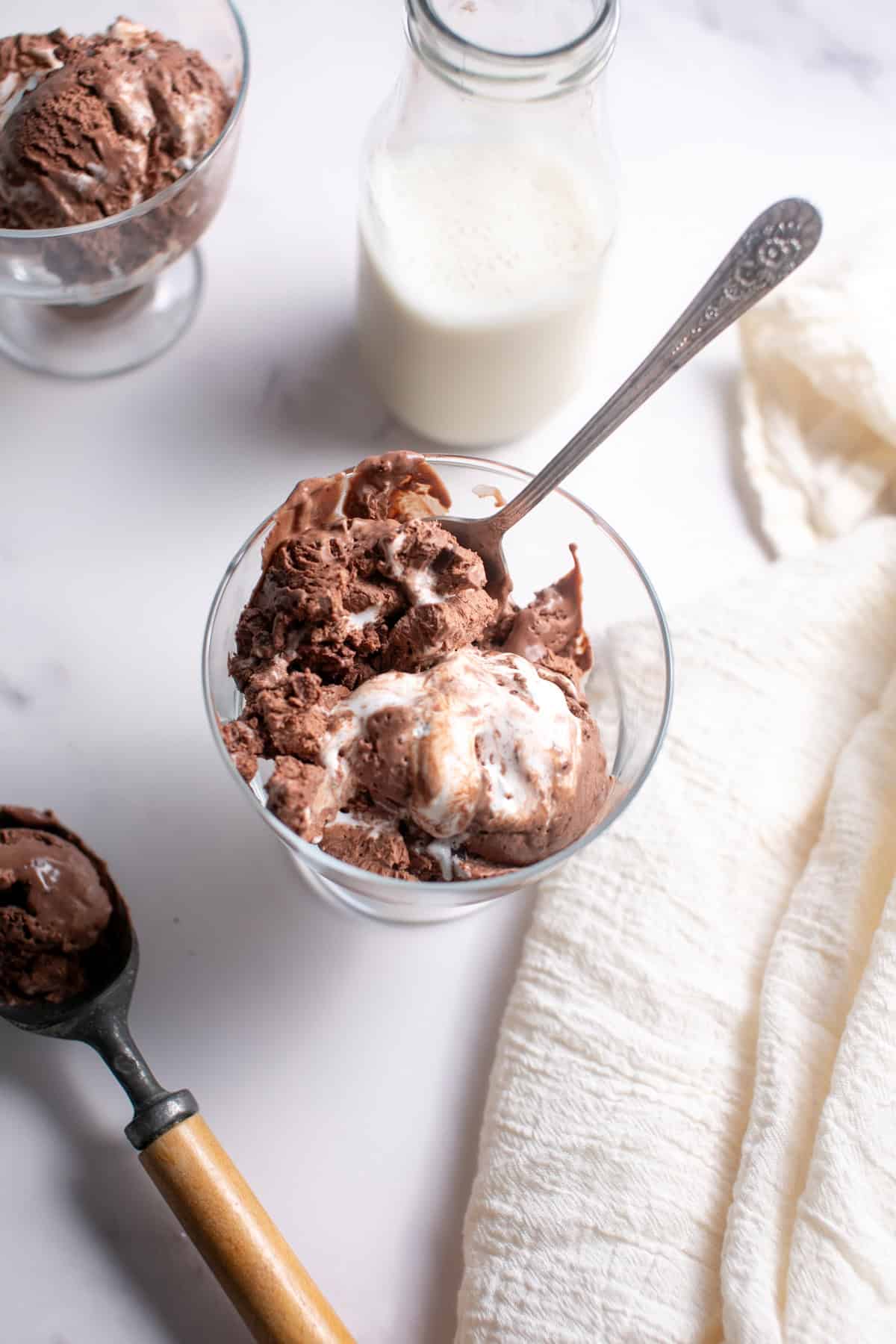 Single Serve Dark Chocolate Marshmallow Ice Cream with an ice cream scoop.