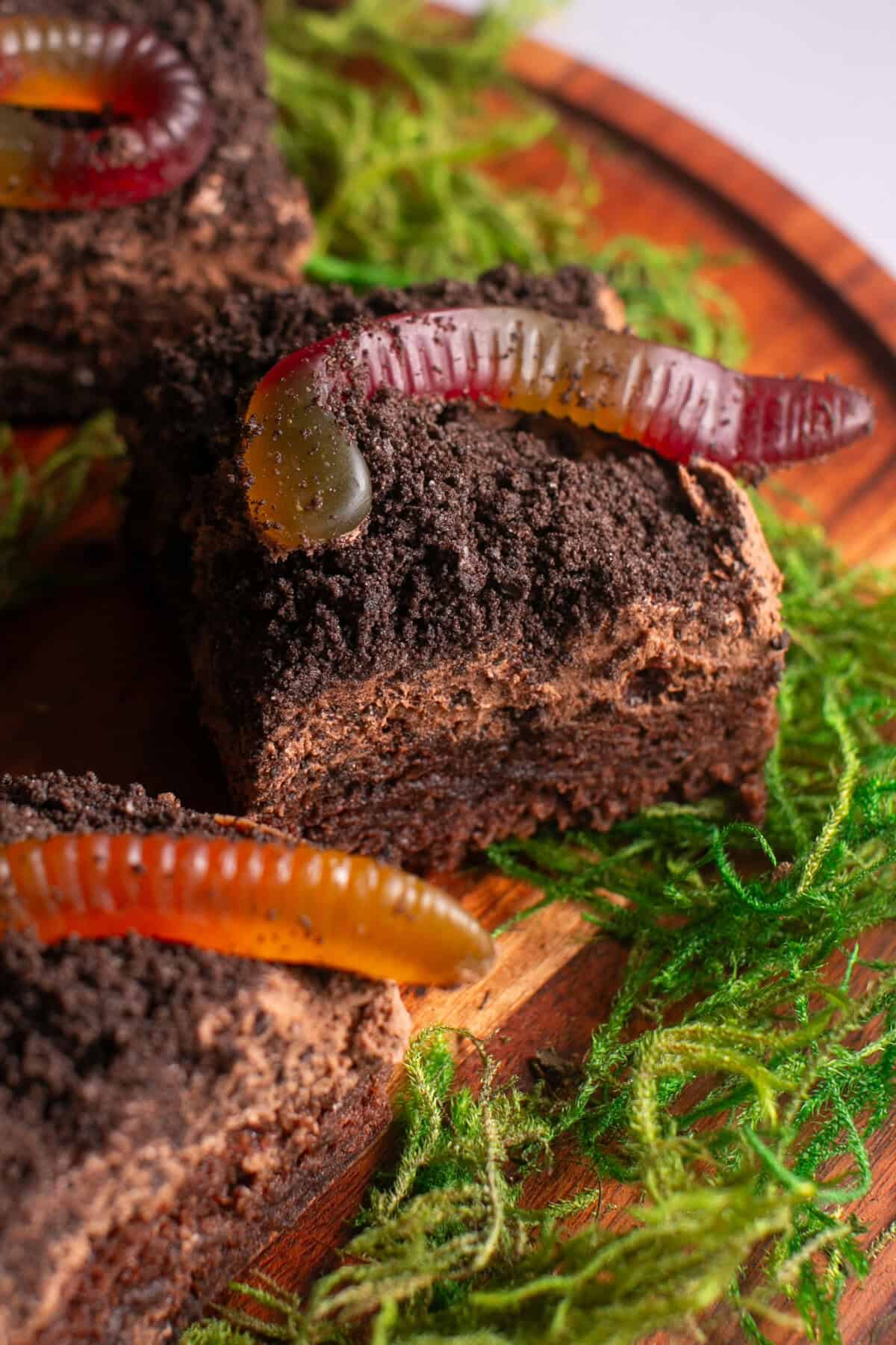 Graveyard brownie cookies with gummy worms on top. 