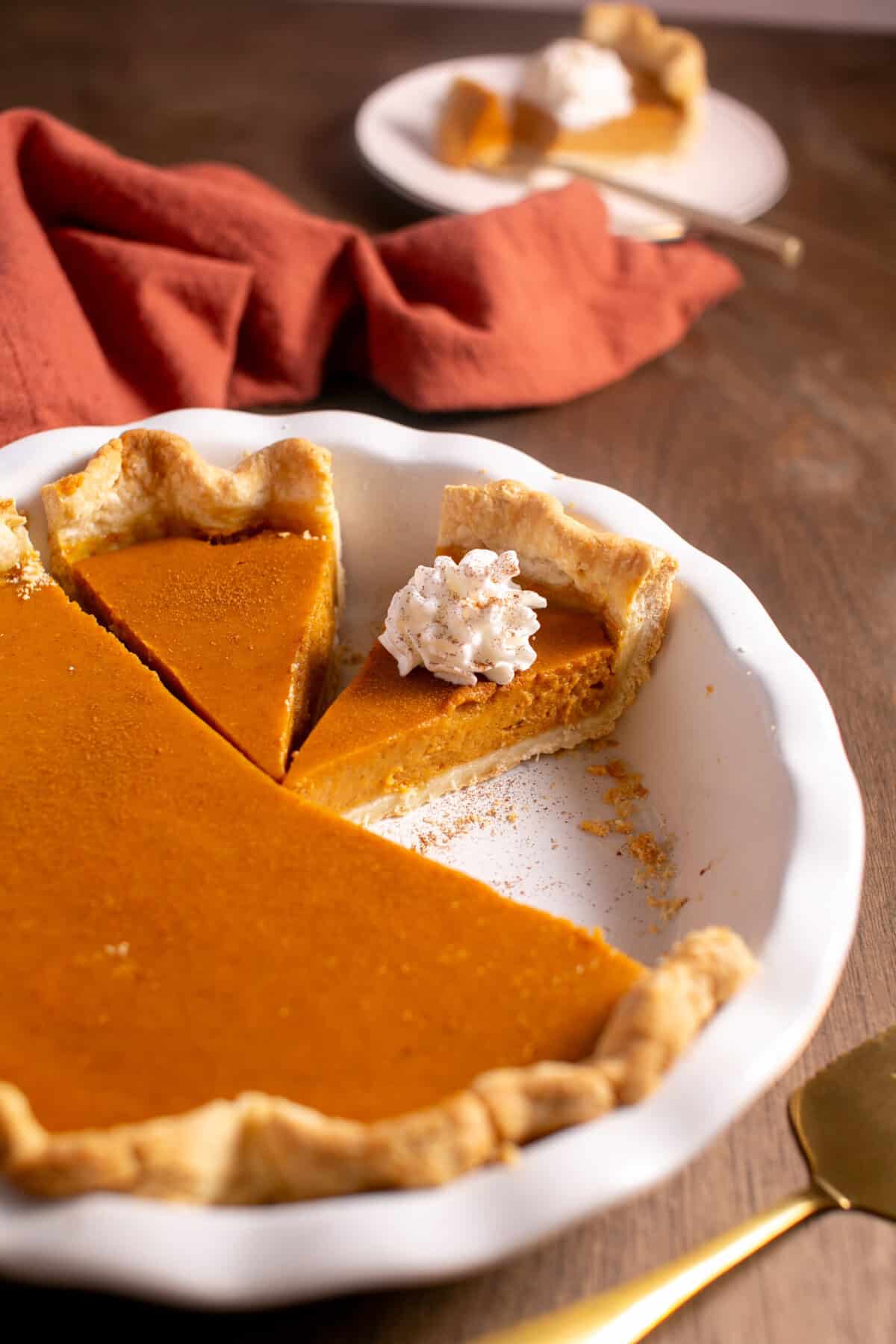 Bourbon Pumpkin pie with a dollop of whipped cream. 