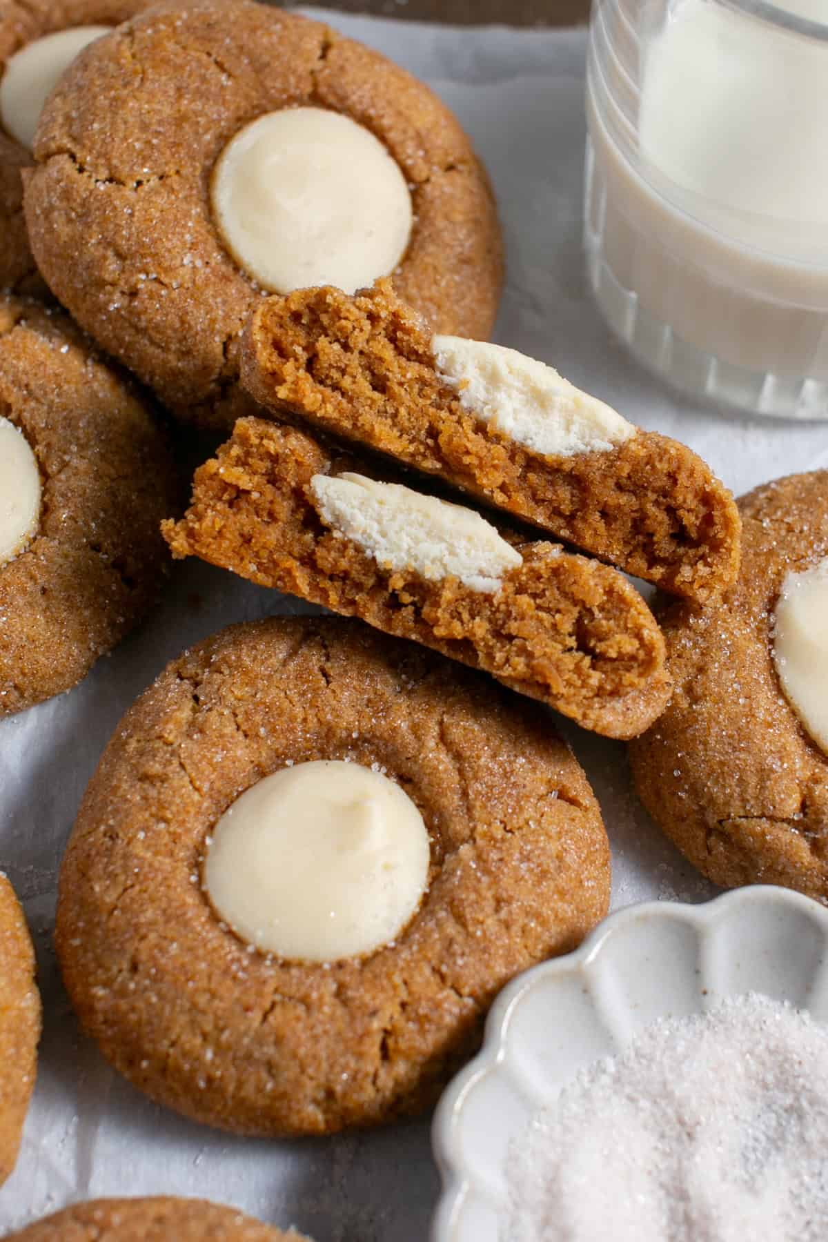 Pumpkin Cookies with Cream Cheese broken in half. 