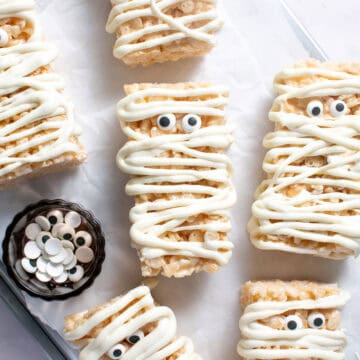 Halloween Mummy Rice Krispie Treats on a baking sheet.