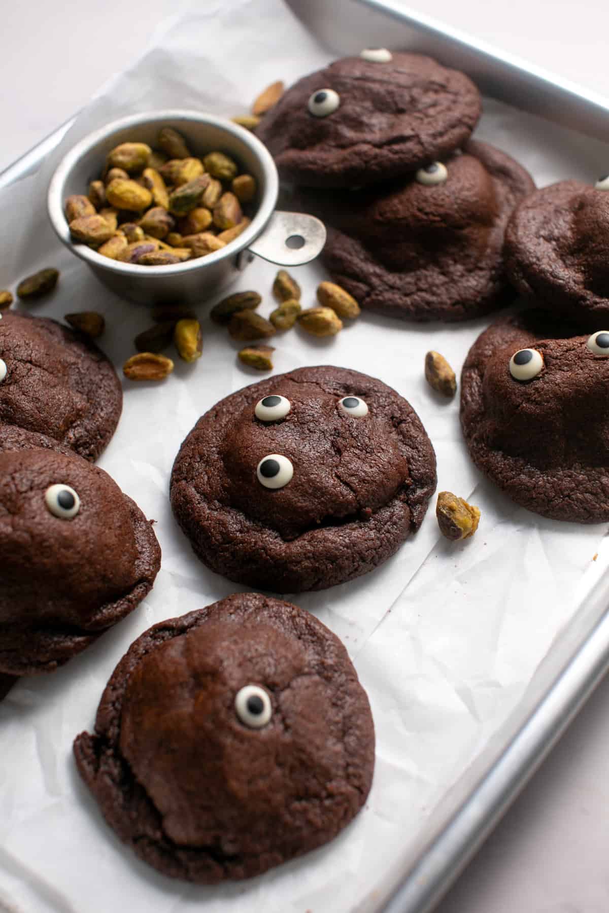 White Chocolate Pistachio Stuffed Cookie Recipe on a sheet tray.