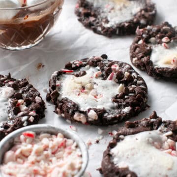 Peppermint Marshmallow Hot Chocolate Cookies by a glass of hot chocolate.