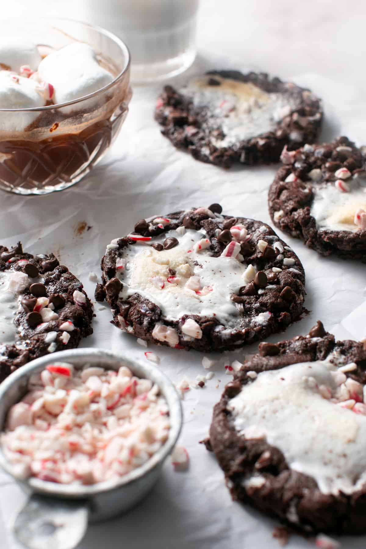 Peppermint Marshmallow Hot Chocolate Cookies by a glass of hot chocolate. 