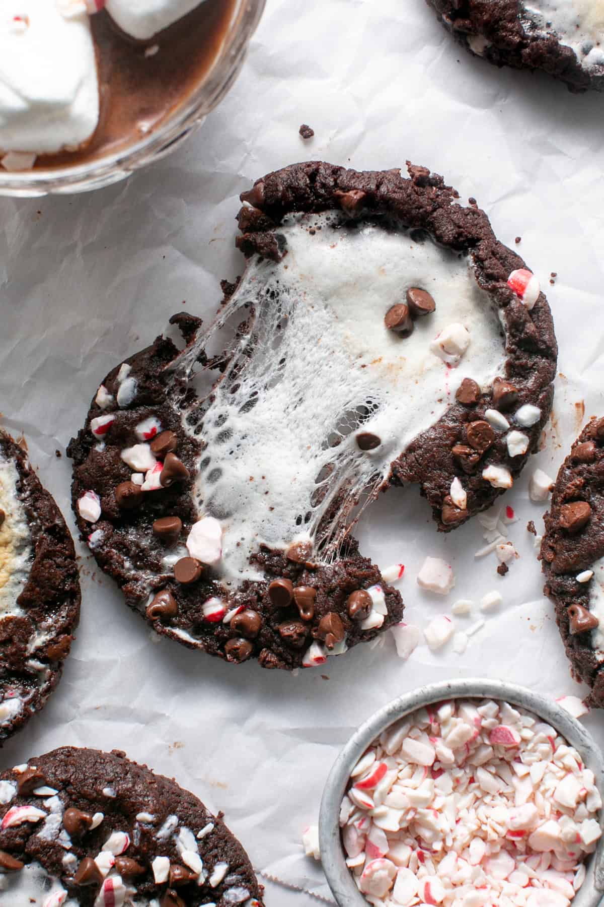 Peppermint Marshmallow Hot Chocolate Cookies with a cookie breaking in half. 