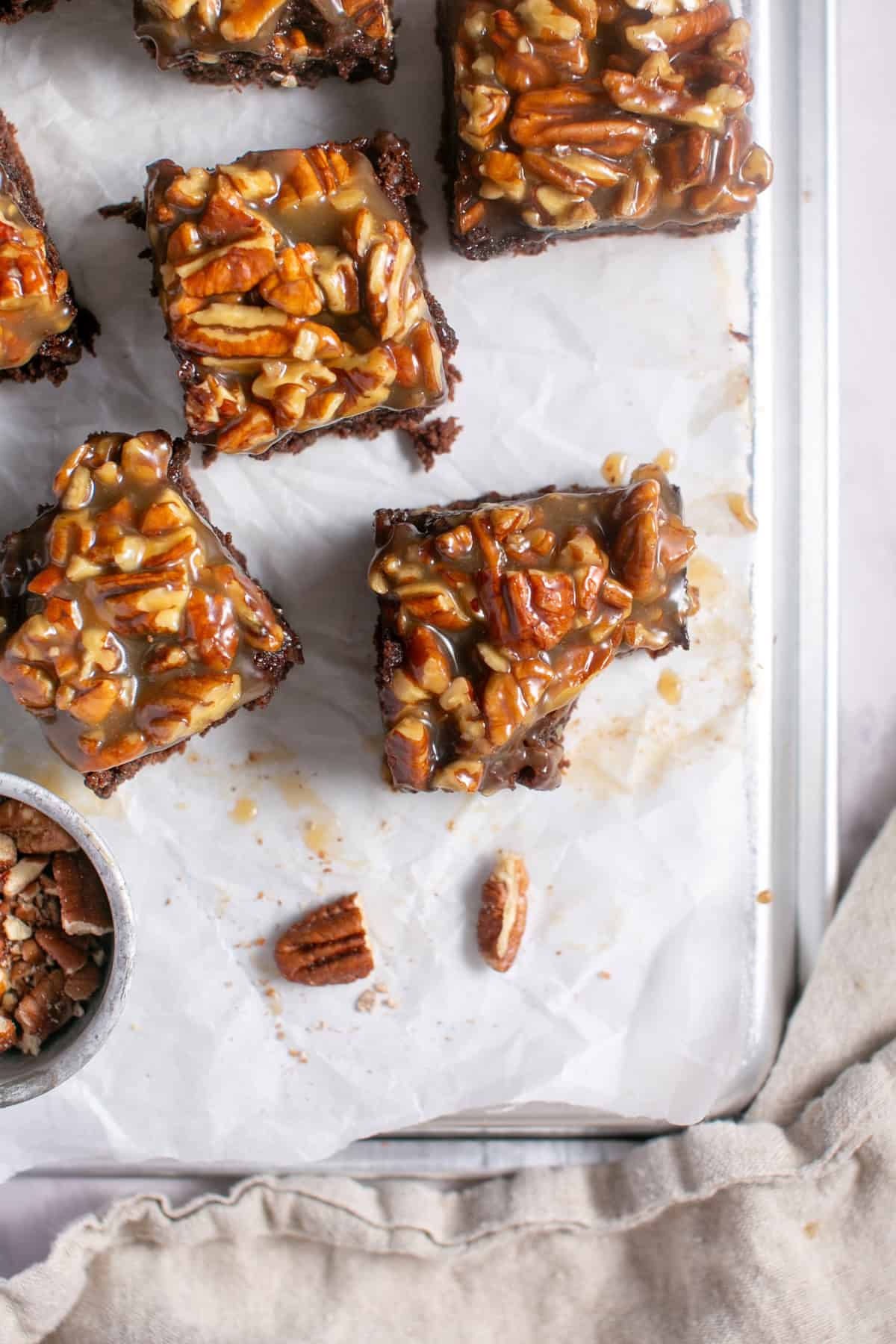 Pecan Pie Brownies on parchment paper.