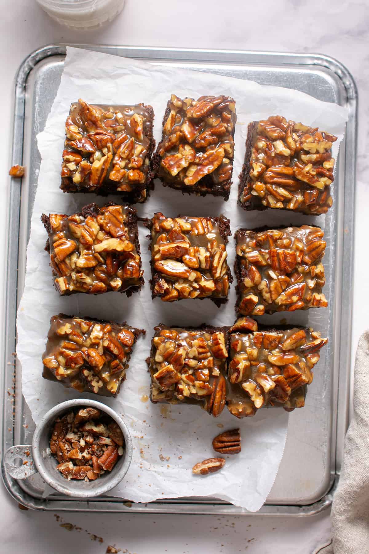 Pecan Pie Brownies with a glass of milk.