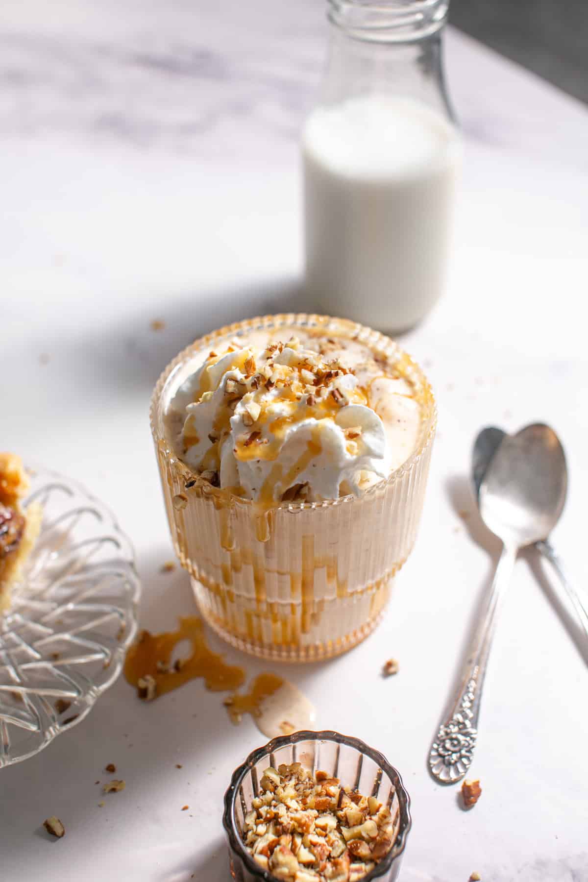 Salted Caramel Pecan Pie Milkshake  with two spoons for eating. 