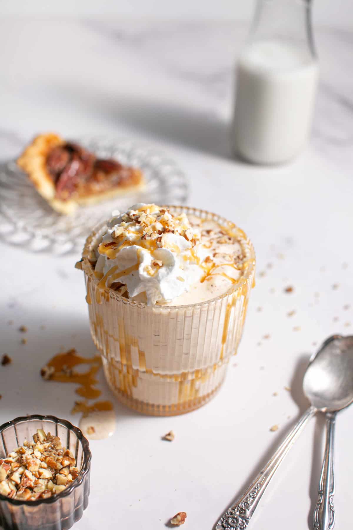 Salted Caramel Pecan Pie Milkshake with a slice of pecan pie. 