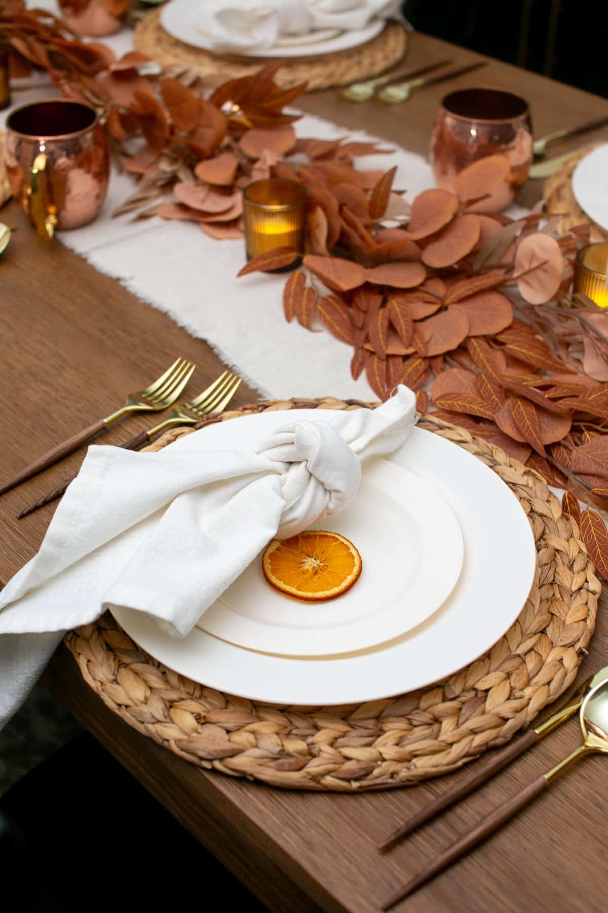 Warm and Cozy Thanksgiving Table Decor Ideas with dried oranges.