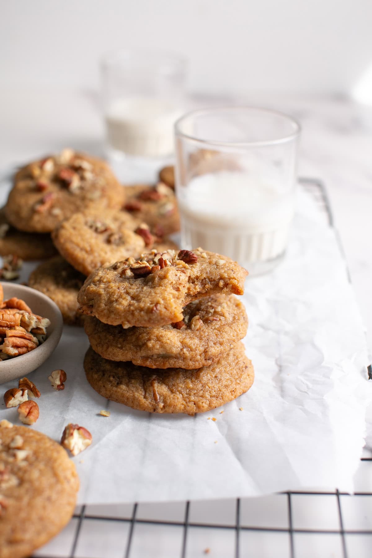 Brown Butter Apple Butter Cookies with Pecans by a glass of milk.