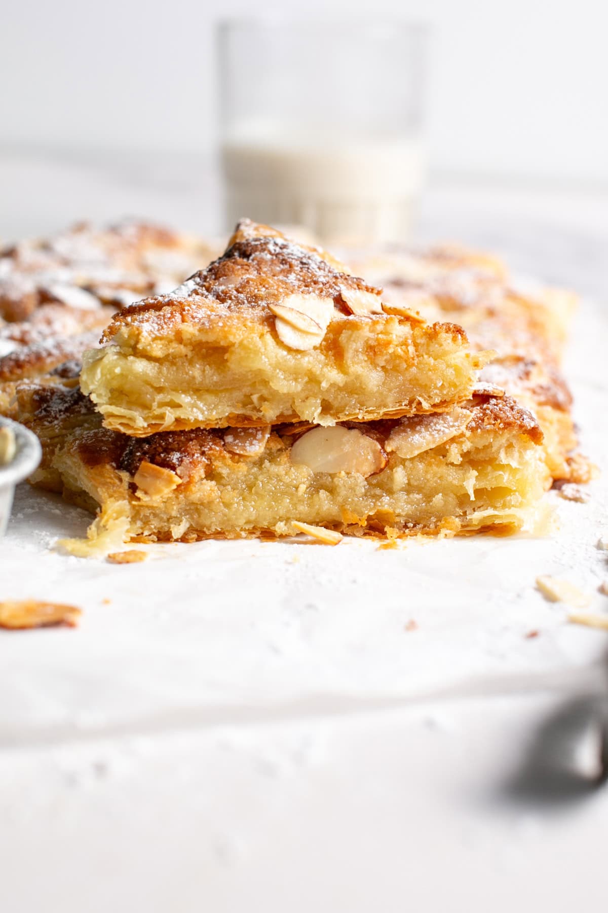 Almond Croissant Puff Pastry Christmas Tree with a glass of milk.