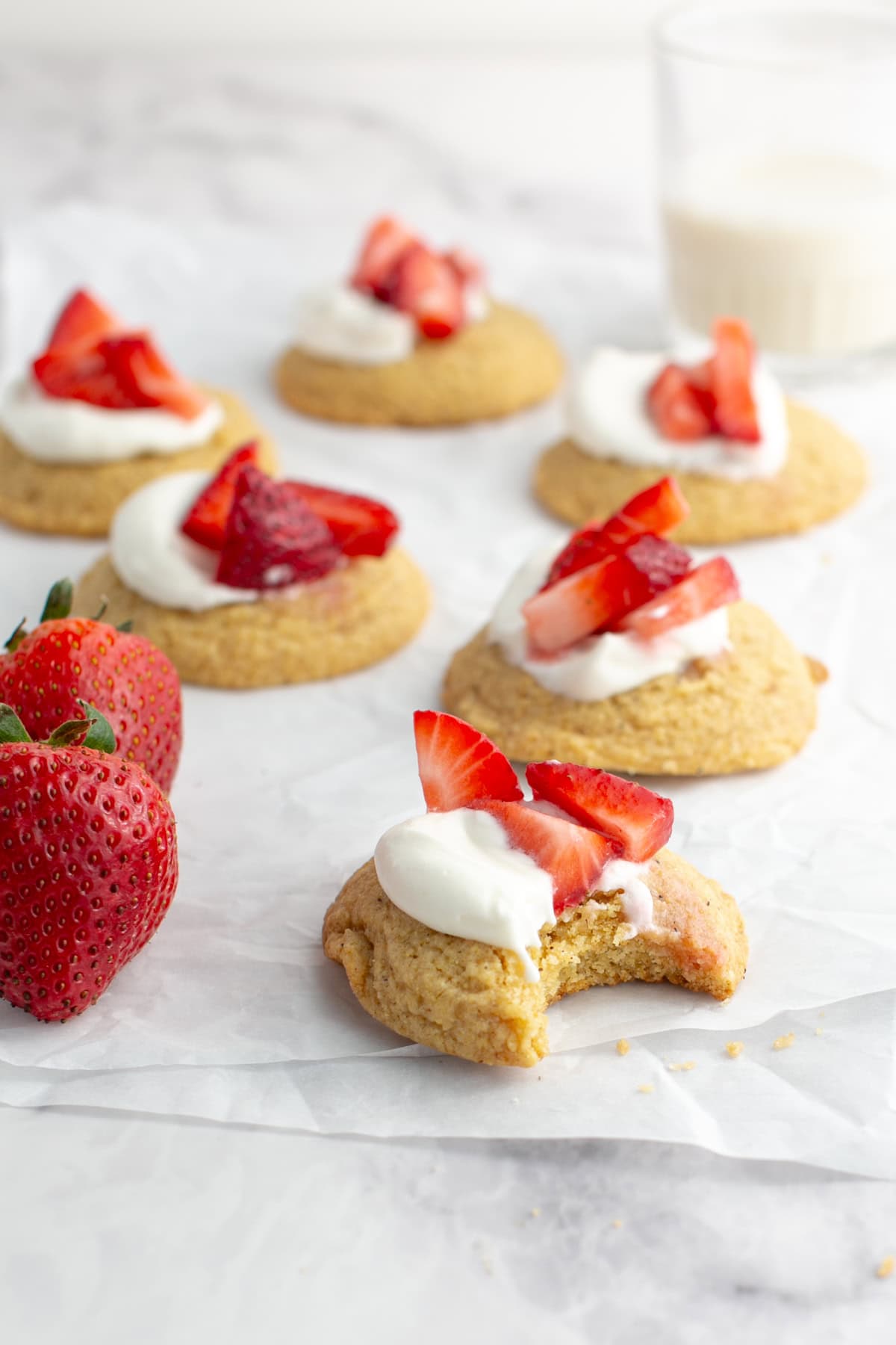 Strawberry Shortcake Cornbread Cookie with a bite missing.
