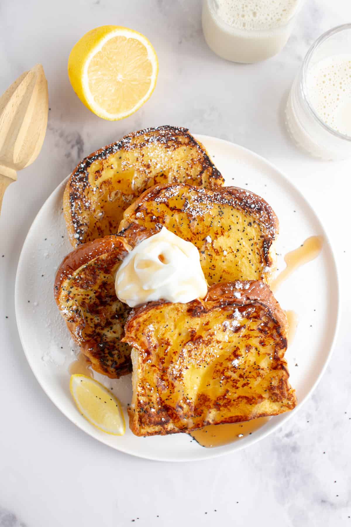 Lemon Poppy Seed Brioche French Toast with a drizzle of syrup.