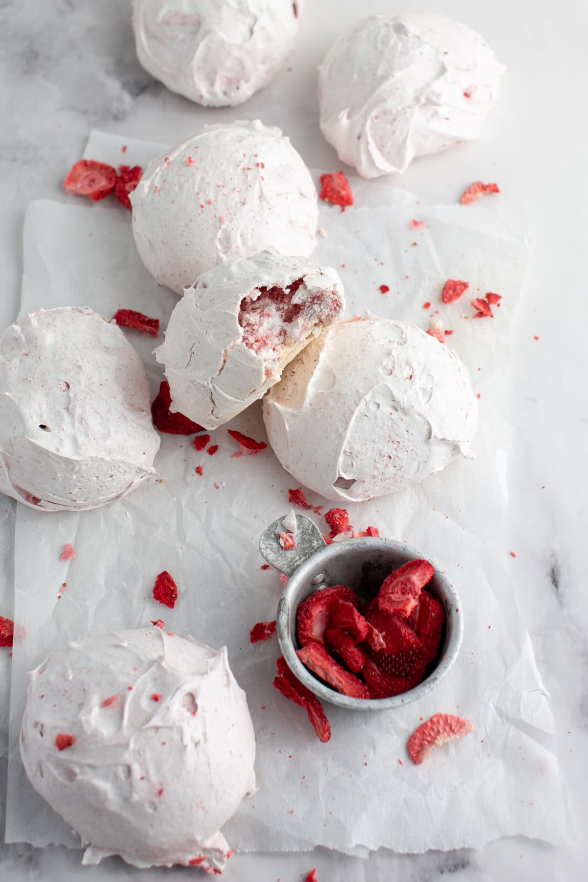 Strawberry Meringue Cloud Cookies stacked on each other.