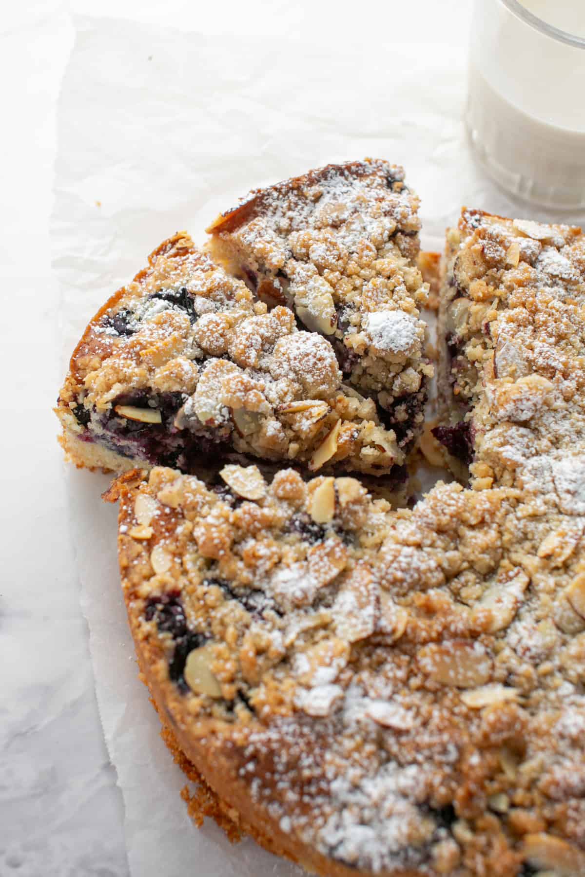 Blueberry Almond Crumble Cake on parchment paper. 