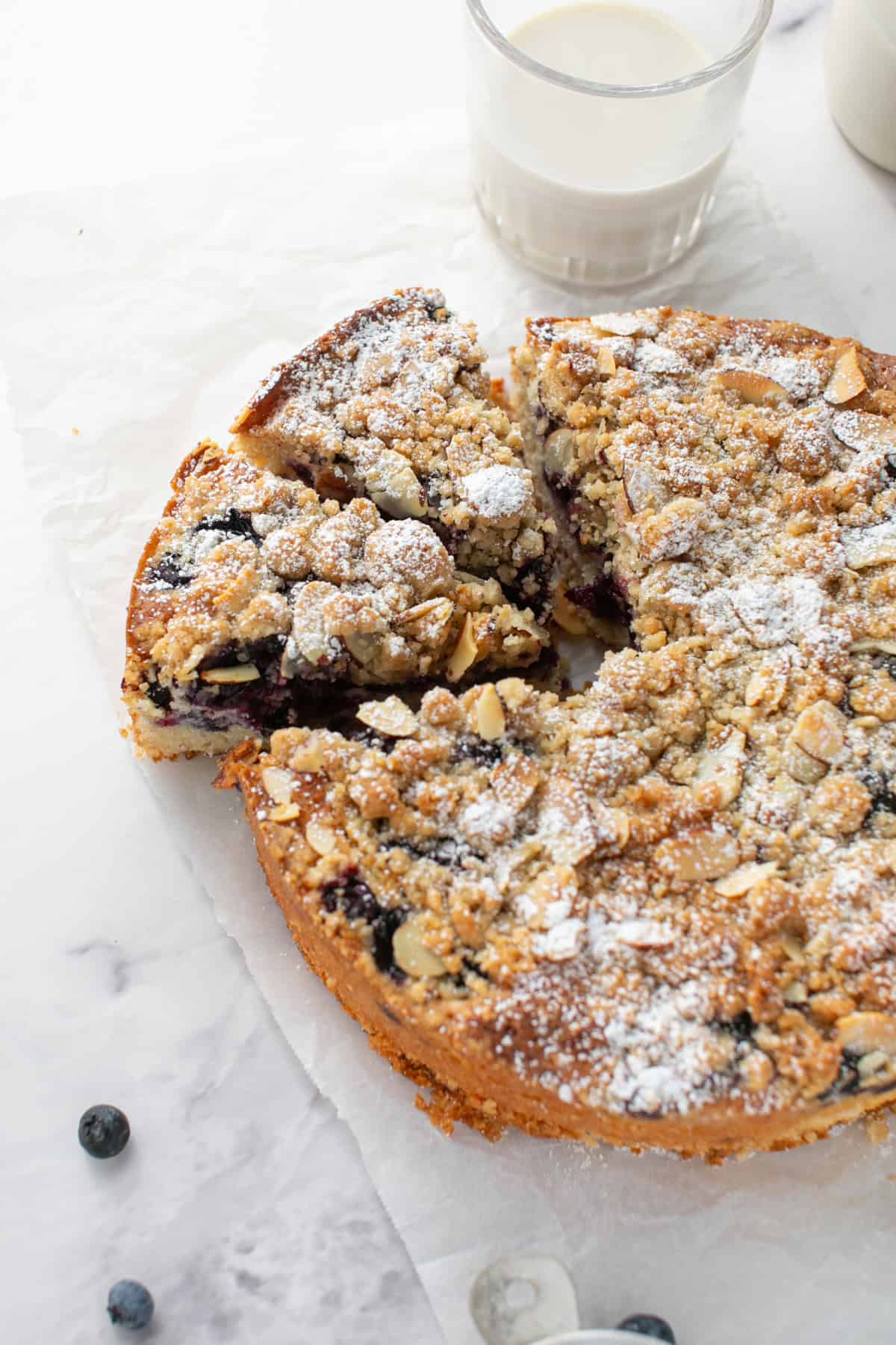Blueberry Almond Crumble Cake cut into two slices.