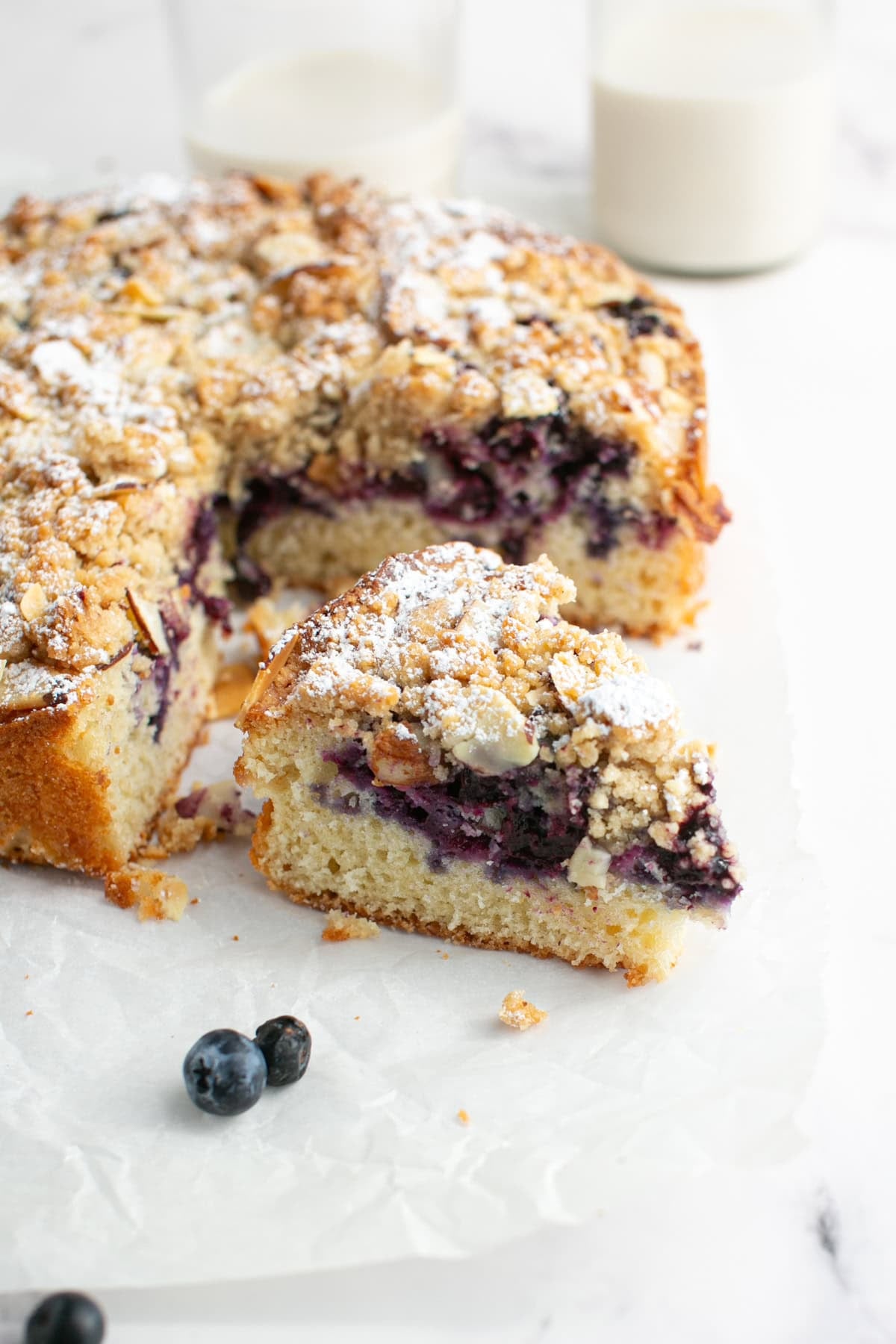 Blueberry Almond Crumble Cake with a single slice.
