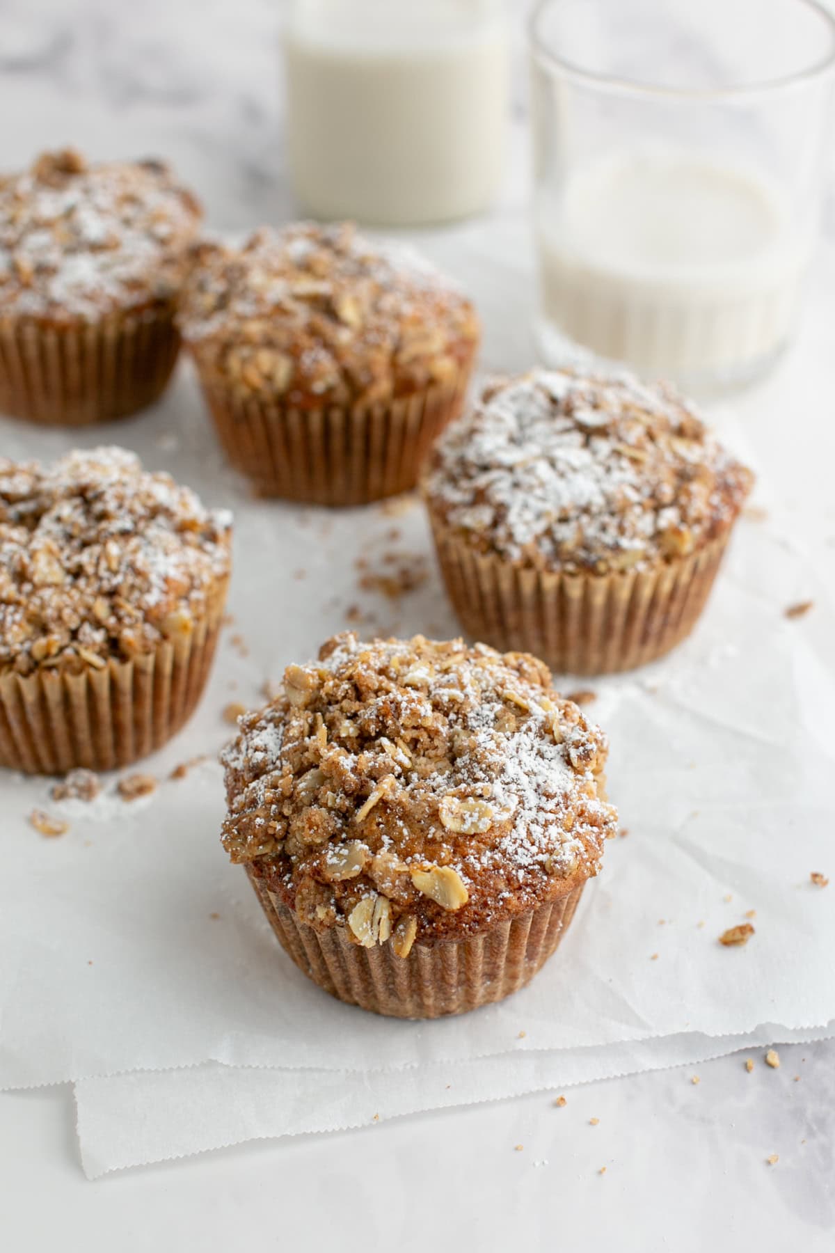 Cinnamon Oatmeal Muffin with a glass of milk.