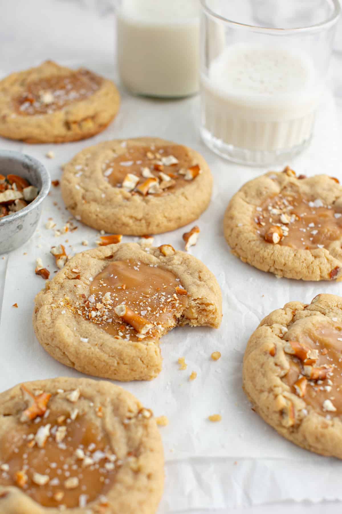  Peanut Butter Caramel cookie by a glass of milk.