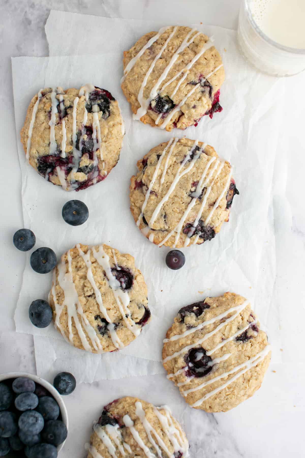 Blueberry Oatmeal Cookies with a bowl of blueberries.