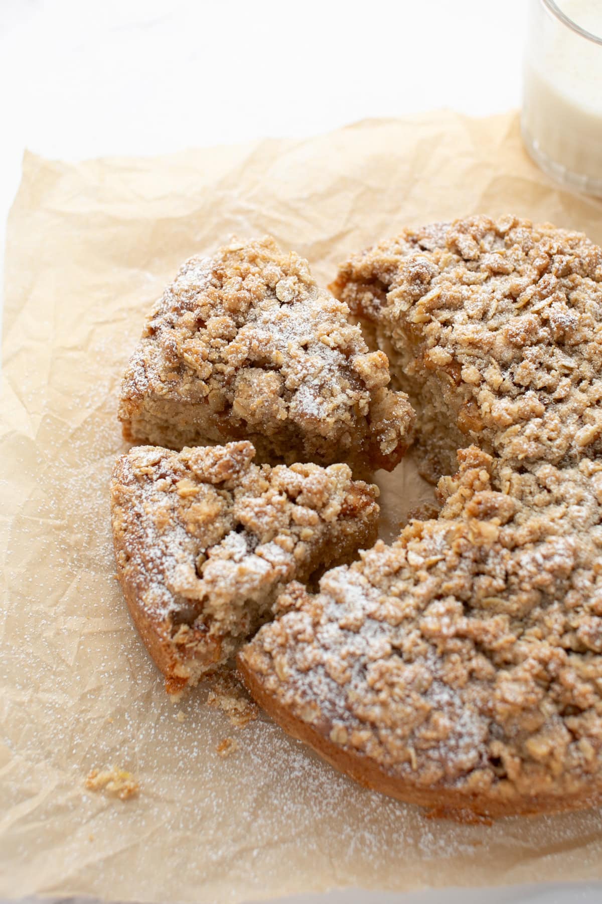 Spiced Apple Crumble Coffee Cake on parchment paper.