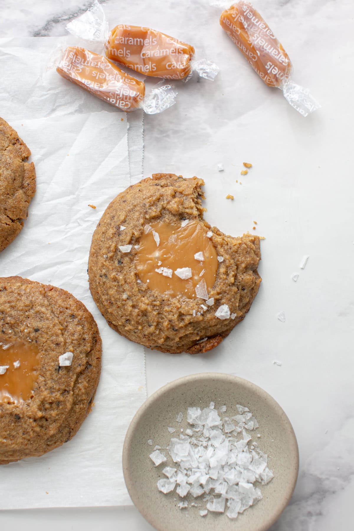 Chewy Caramel Coffee Cookies with a bite missing and some crumbs.
