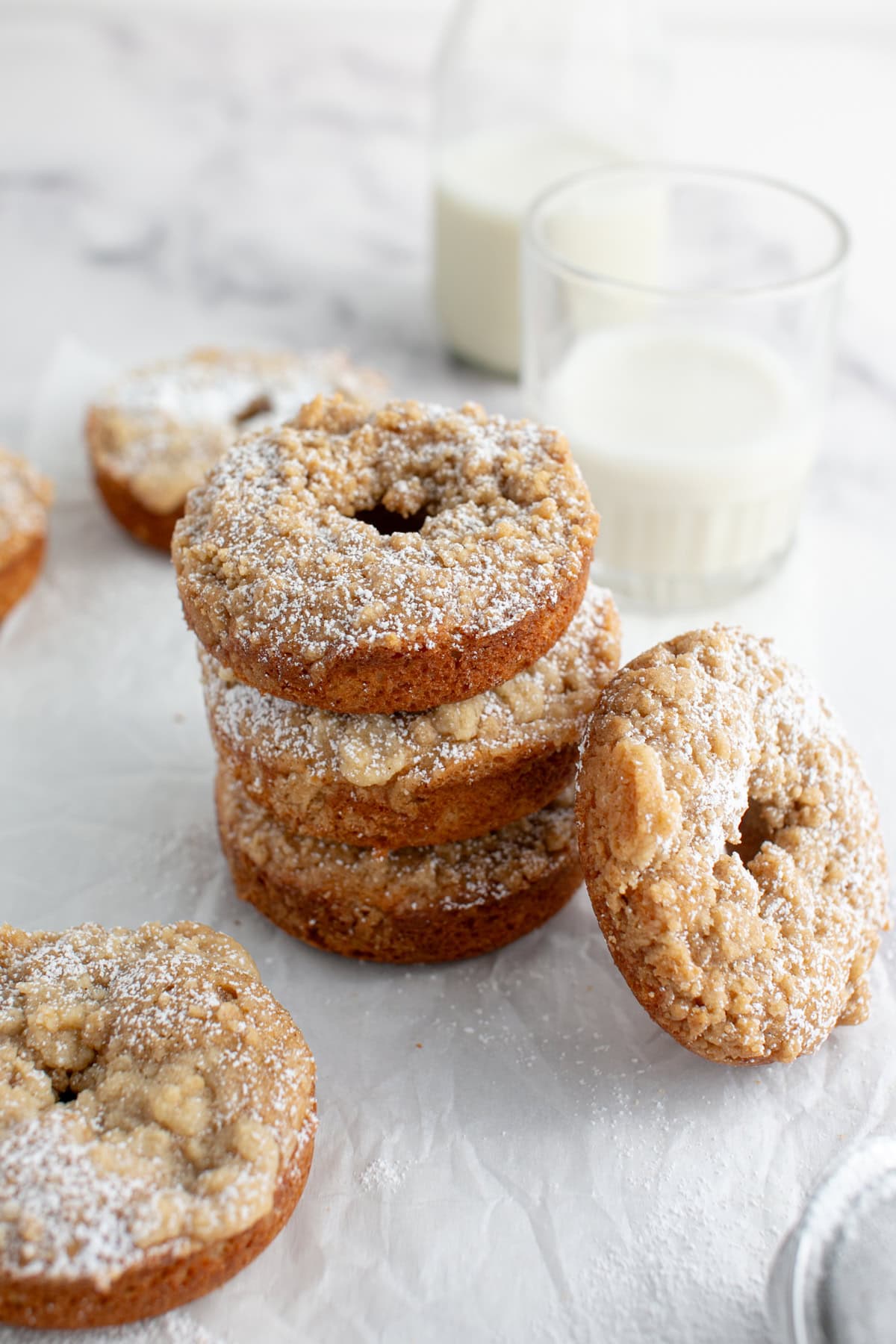 Cinnamon Sugar Crumble Donuts by a glass of milk.