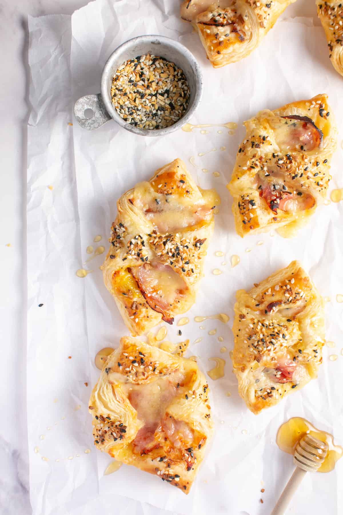 Ham and Cheese Breakfast Pastry on parchment paper.