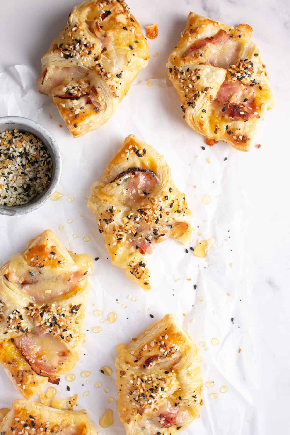 Ham and Cheese Breakfast Pastry with a bite missing.