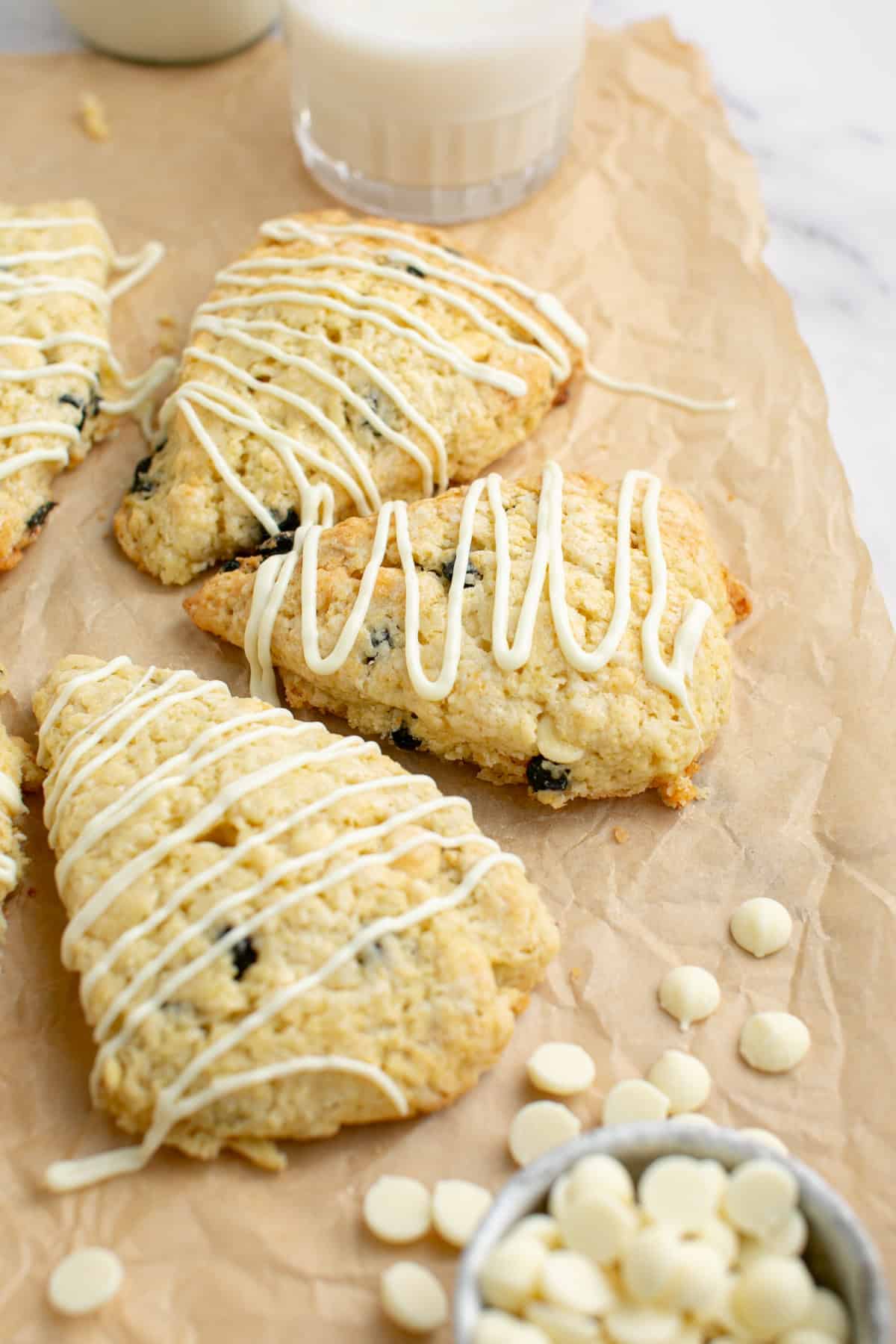 White Chocolate Chip Blueberry Scone by a glass of milk.