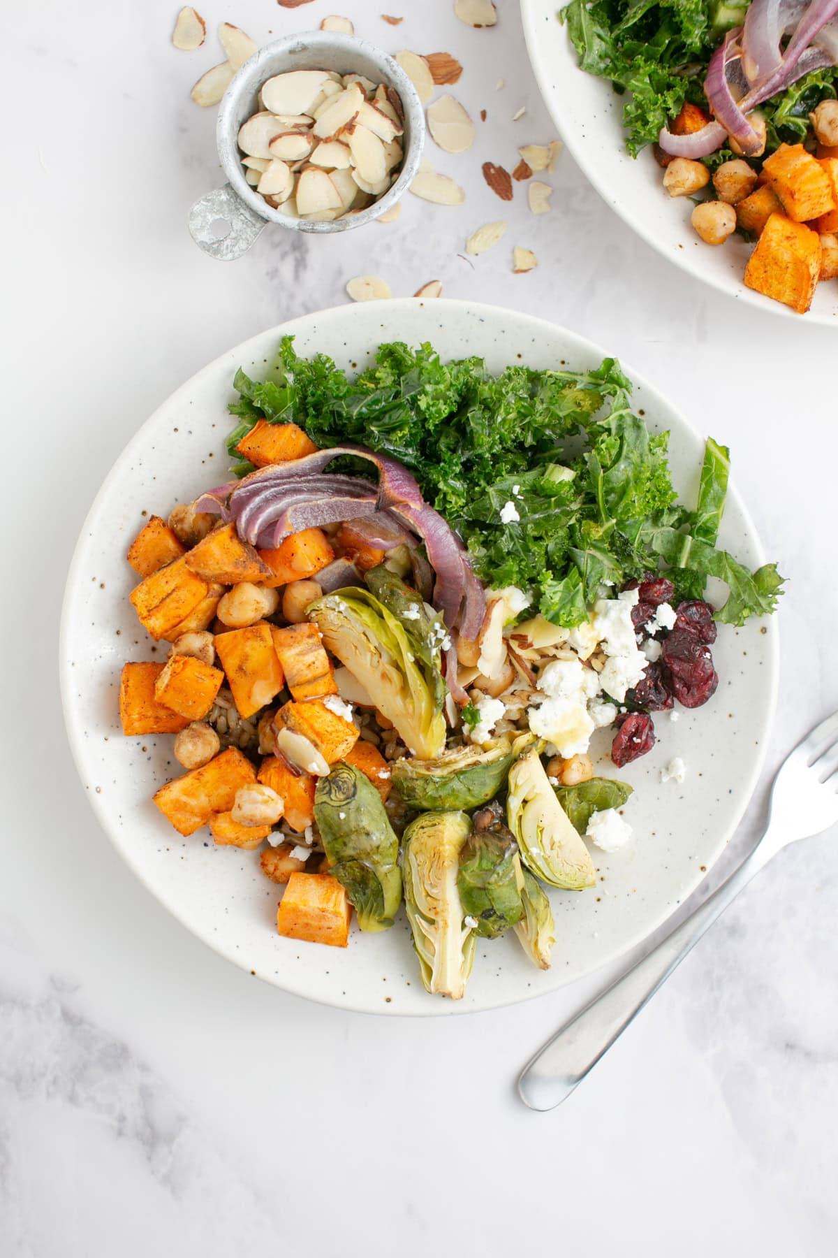Sweet Potato Harvest Grain Bowl with a bowl of almonds.