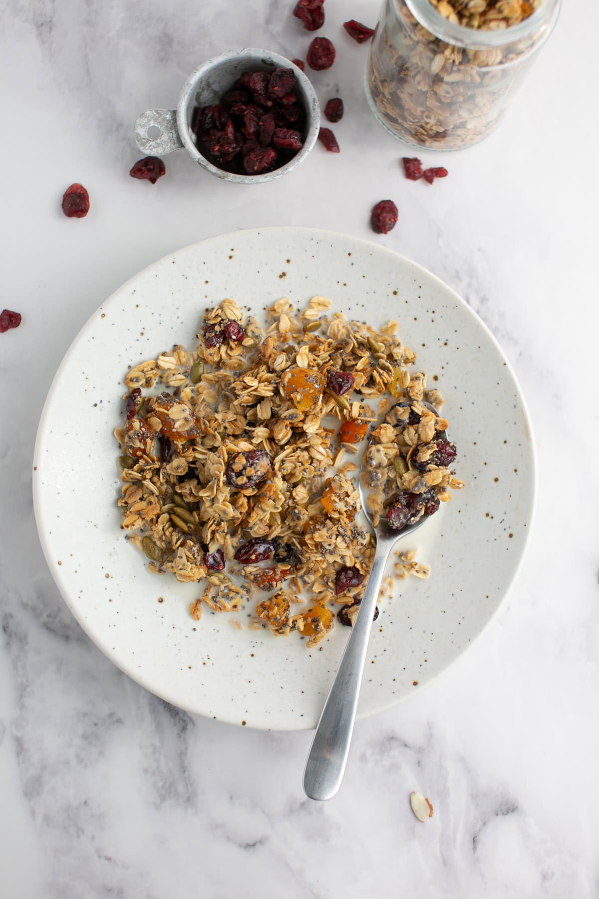 Maple Pumpkin Spice Granola with a spoon.