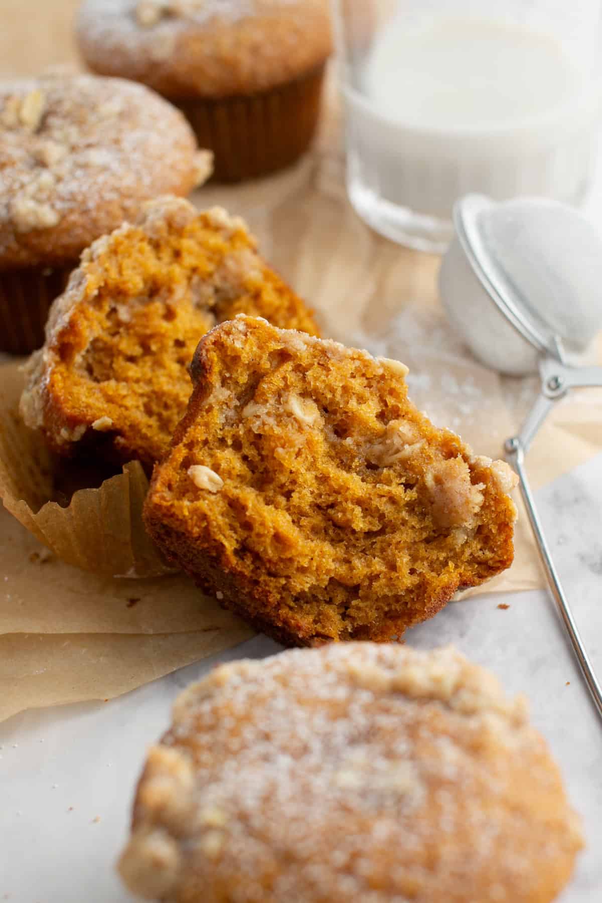 Cinnamon Maple Oat Pumpkin Muffin cut in half.