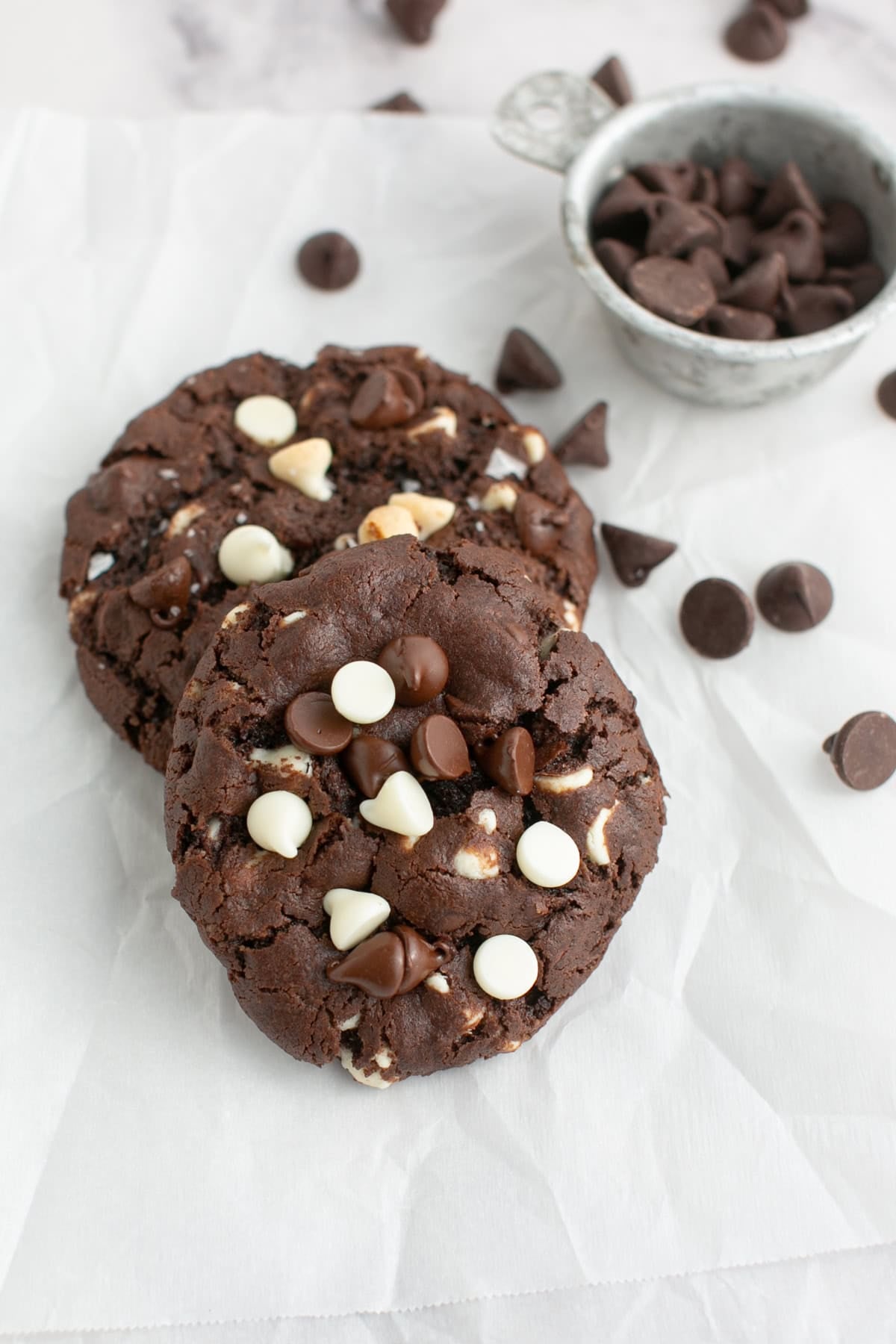 Triple Chocolate Chunk Cookie on parchment paper.