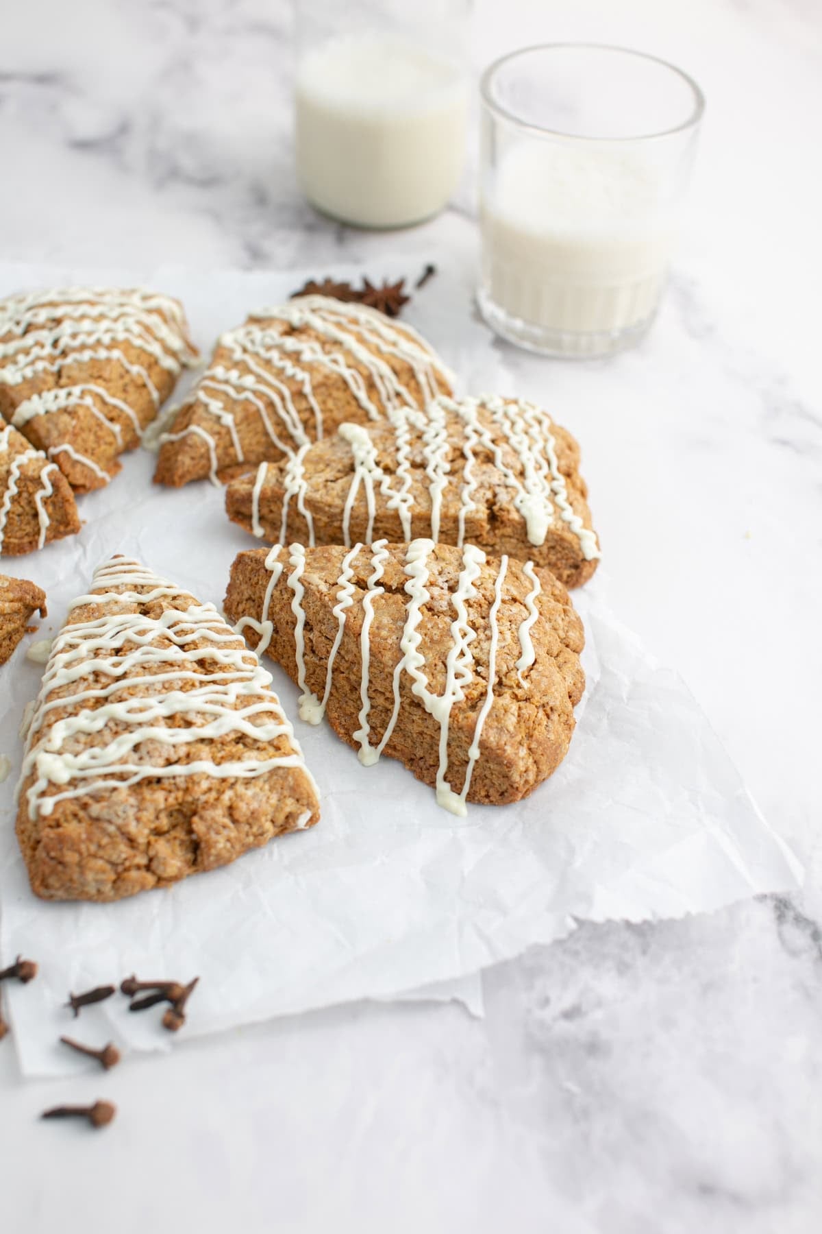 Gingerbread Scone stacked on parchment paper.