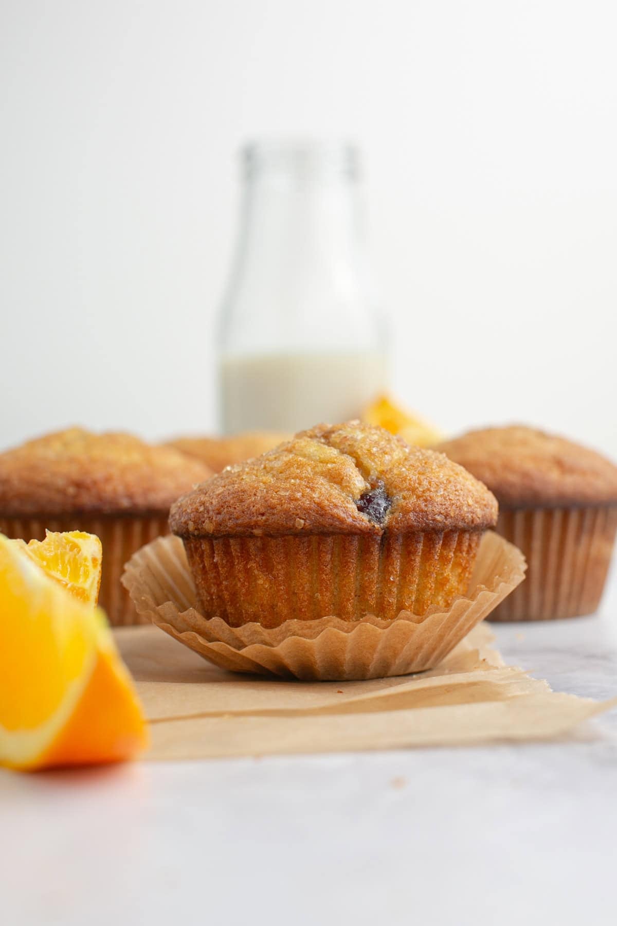 Cranberry Sauce Orange Muffins on parchment paper.