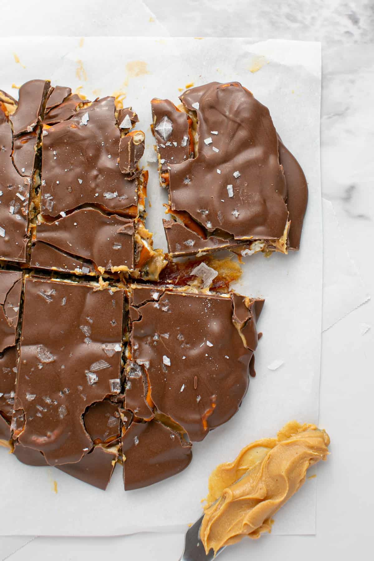 Chocolate Peanut Butter Pretzel Date Bark with a sprinkle of salt.