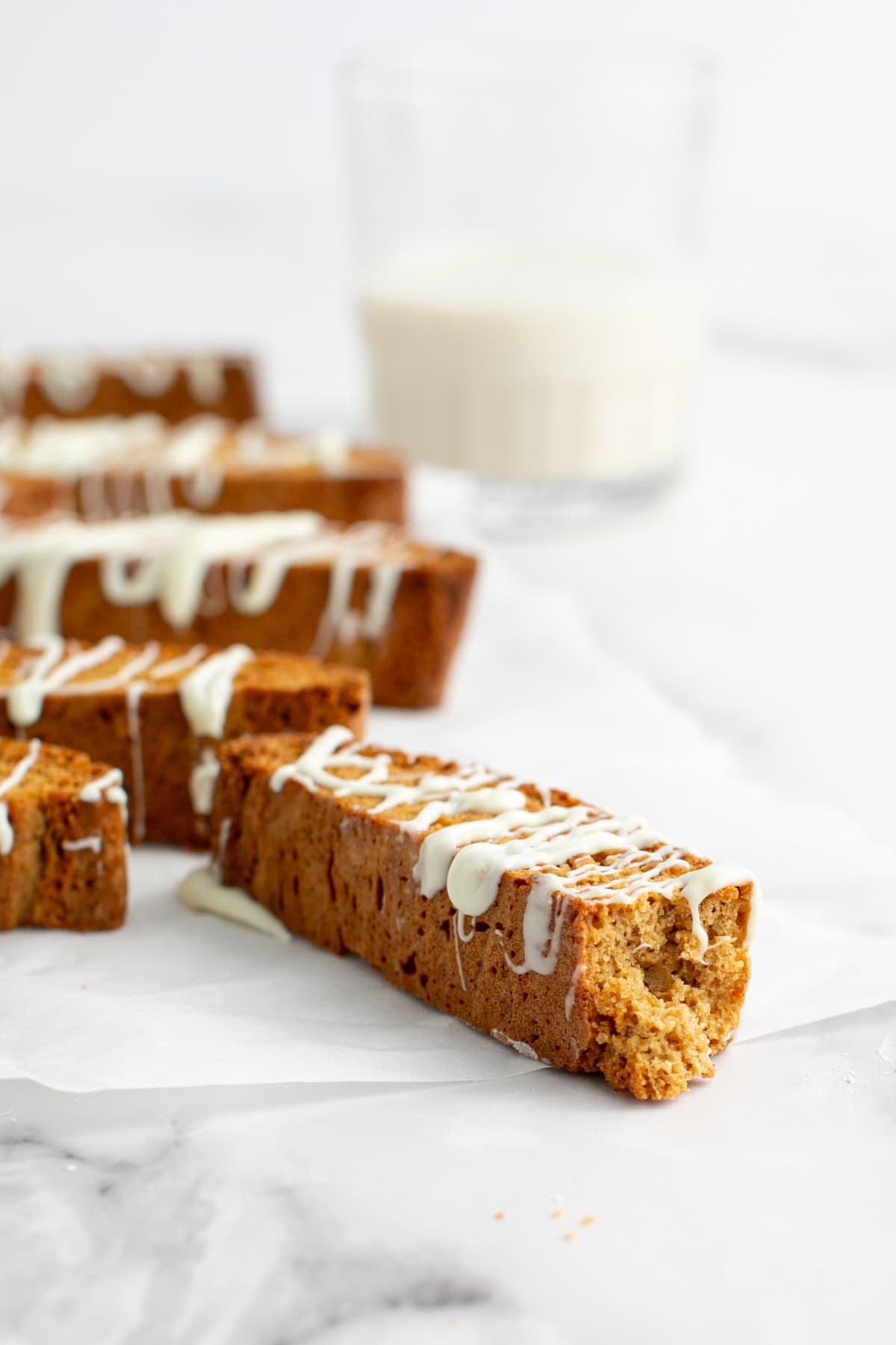 Orange Gingerbread Biscotti with a bite missing.