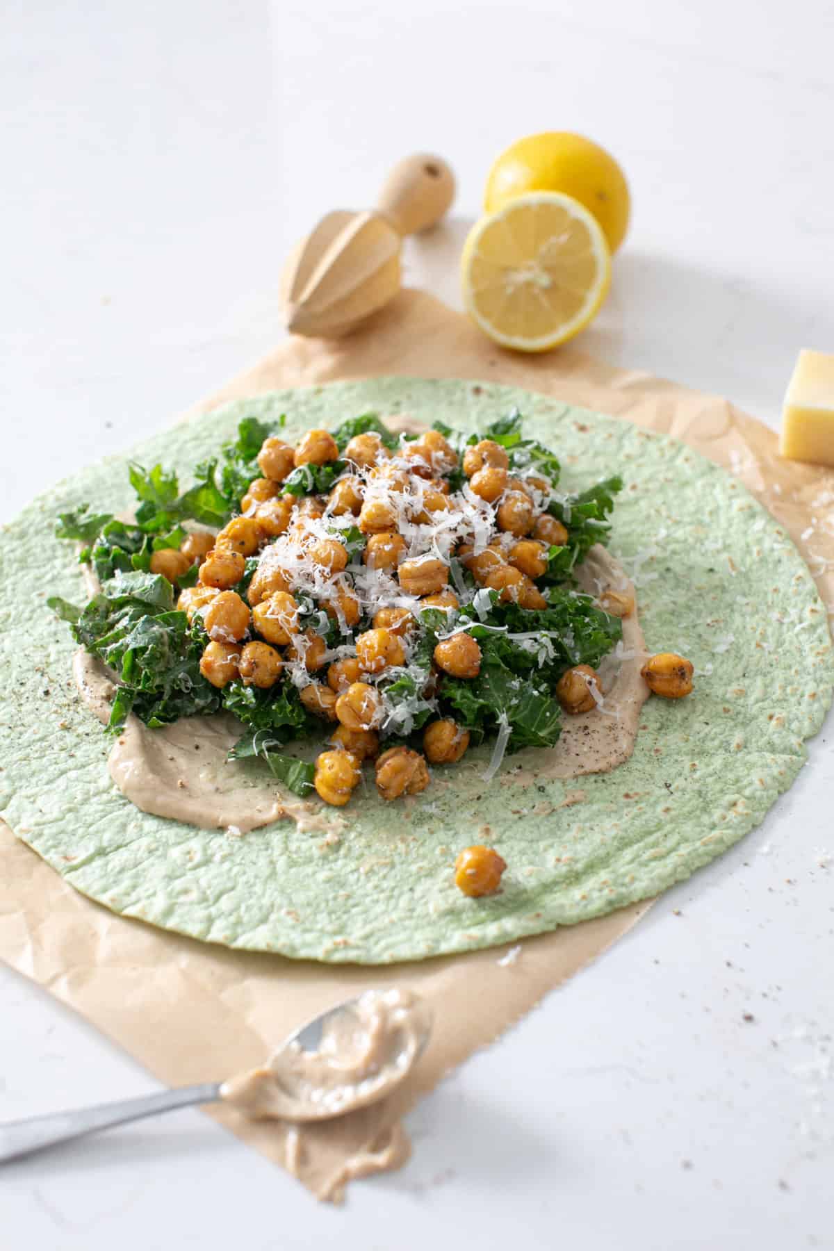 Chickpea Caesar wrap on parchment paper.